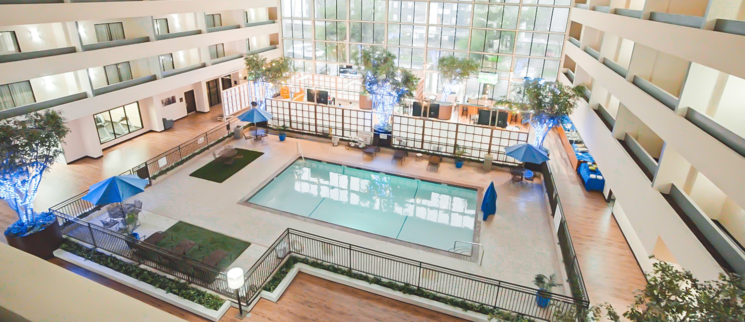 EXPERIENCE SOUTHERN HOSPITALITY AND ELEGANT ACCOMMODATIONS AT ATRIUM HOTEL AND SUITES DFW 